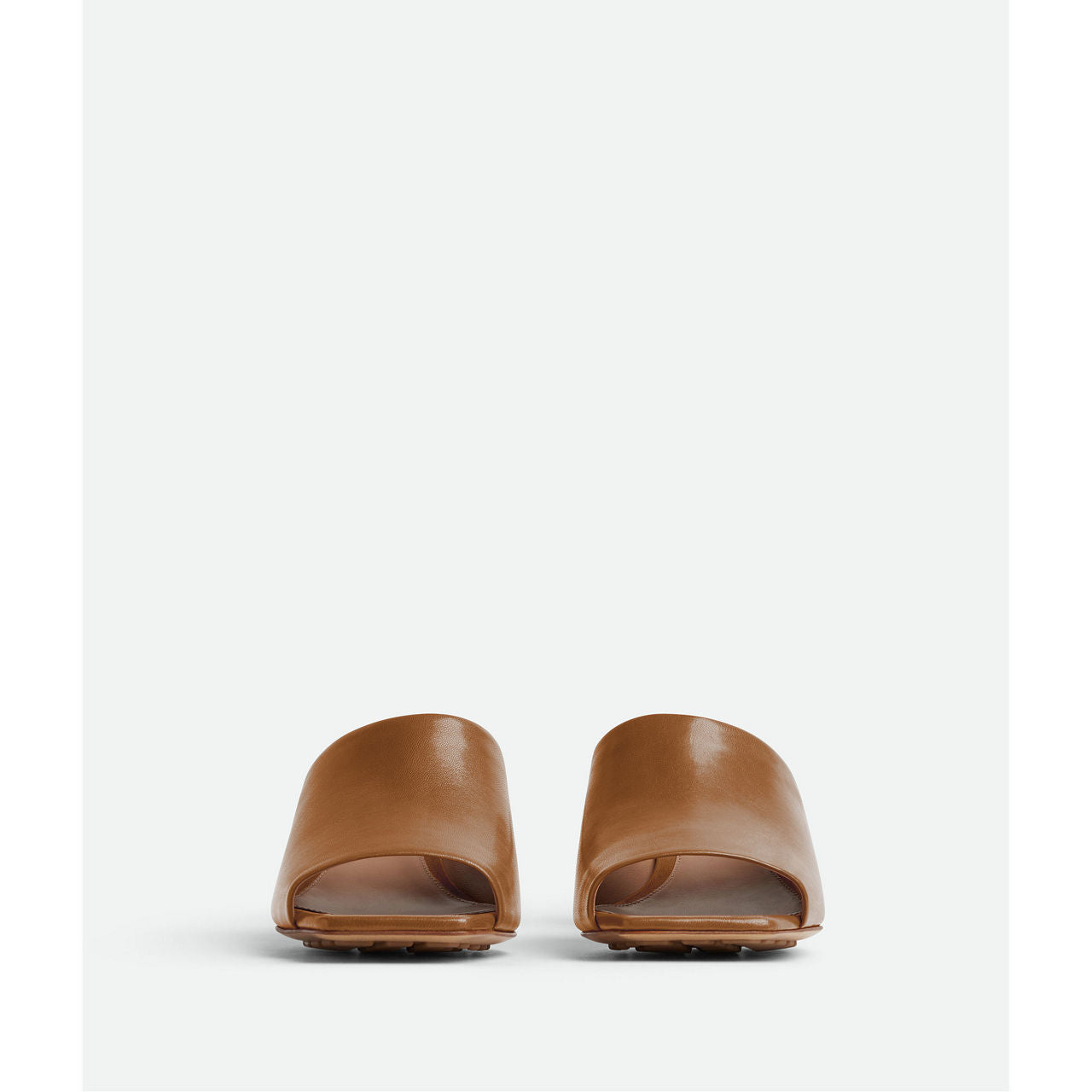 Mule with gold finished metal knot heel