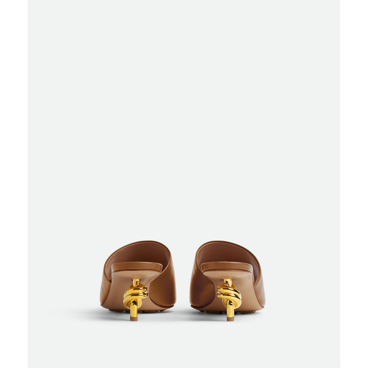 Mule with gold finished metal knot heel