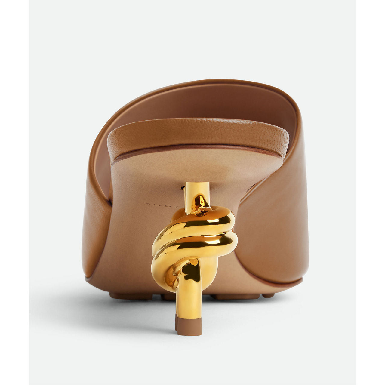 Mule with gold finished metal knot heel