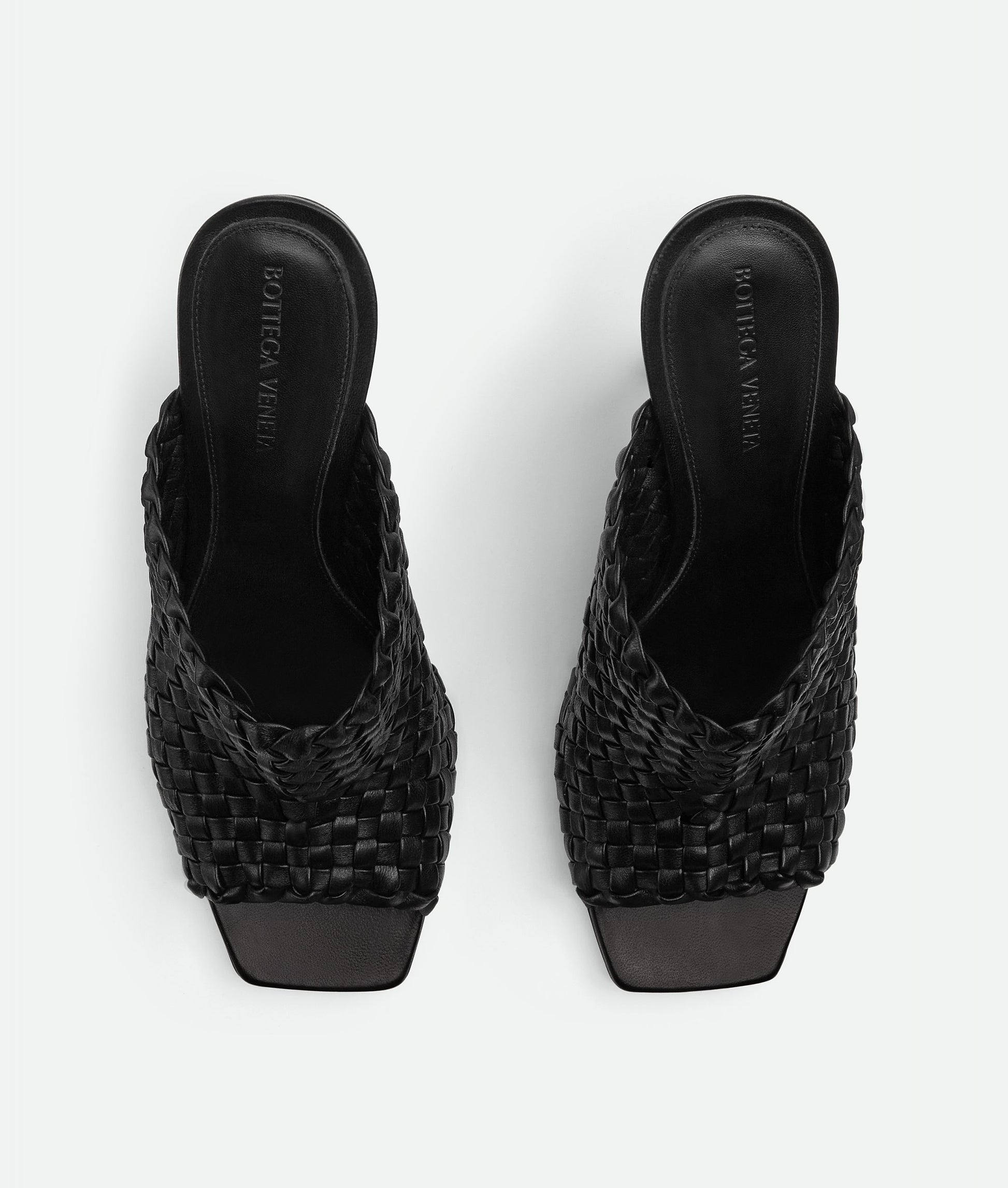 Mules in Woven Black leather
